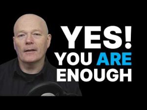 An image of John McLauchlan in front of a black background with the words YES! You Are Enough